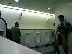 Asian boy in public toilet